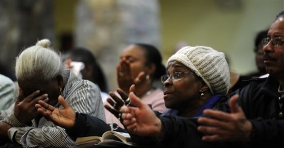 Congregation members pray during a Mass at the Roman Catholic church in Spring Valley, N.Y., on Jan. 21. Almost every Haitian in this village has lost a loved one in the Jan. 12 earthquake in Haiti.